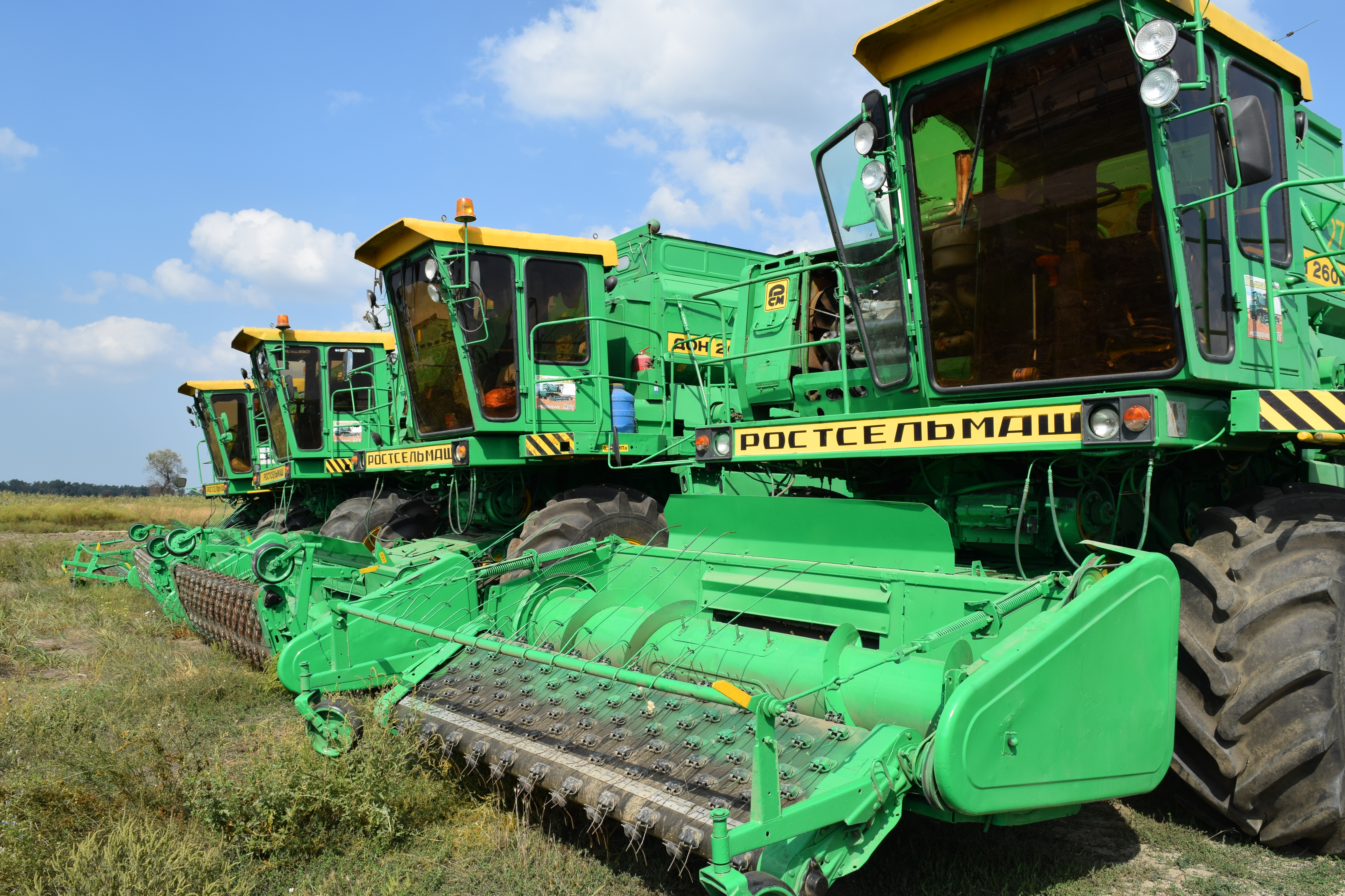 agricultural combines in a field